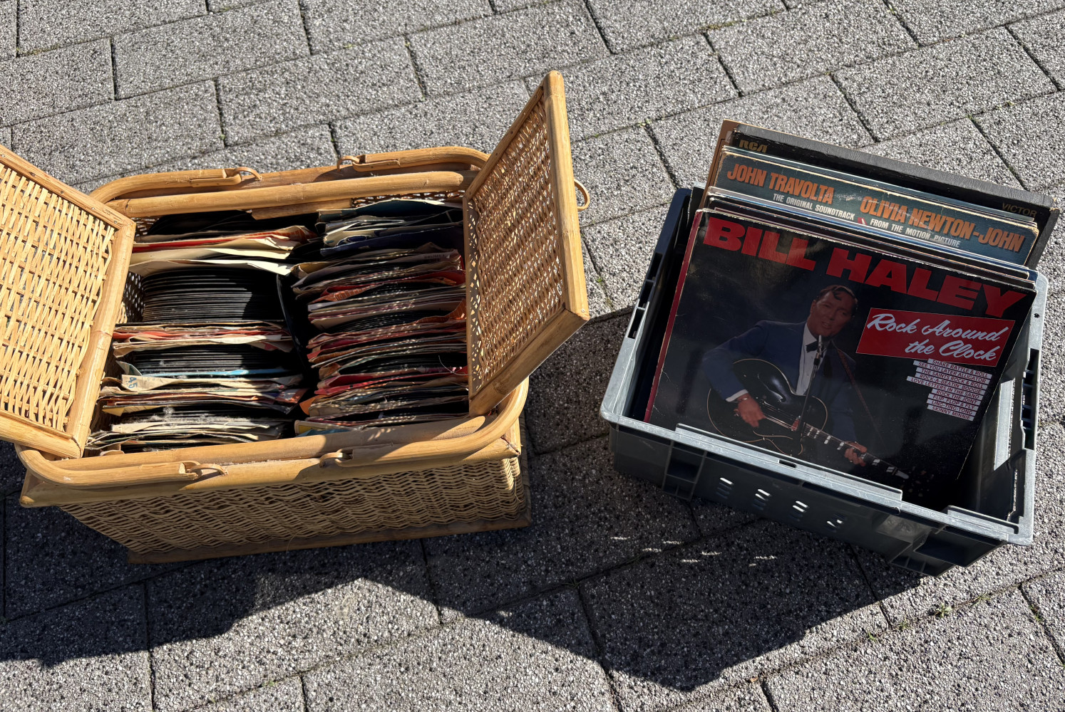 Picnic hamper full of records and box of mixed 12 inch records