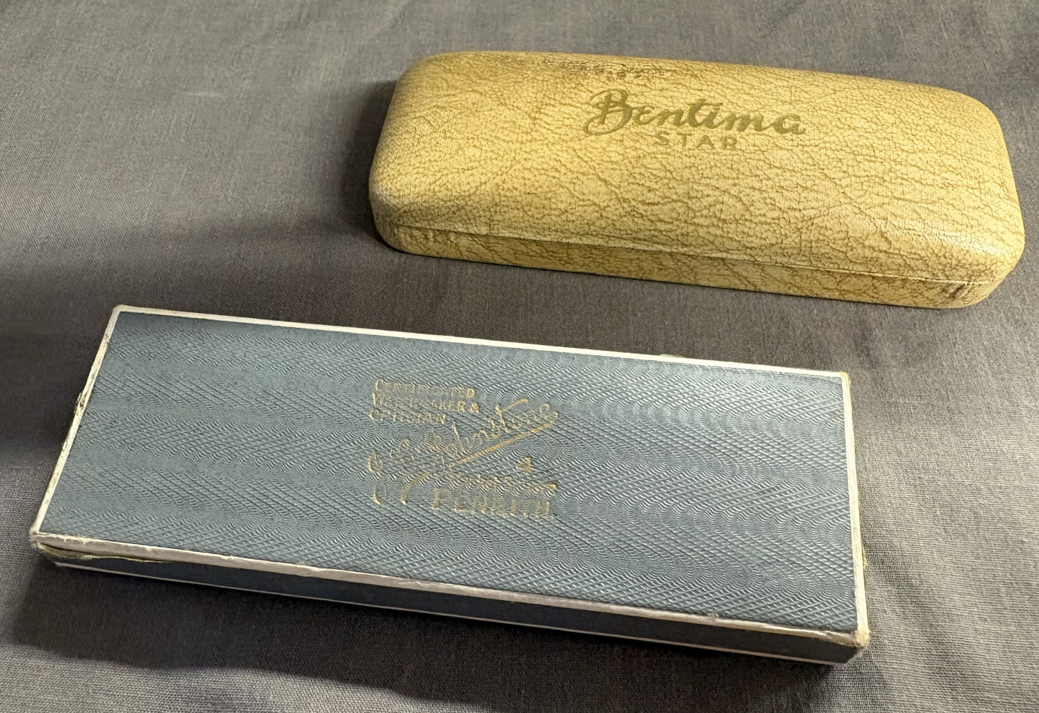 Two vintage watch boxes both with original straps
