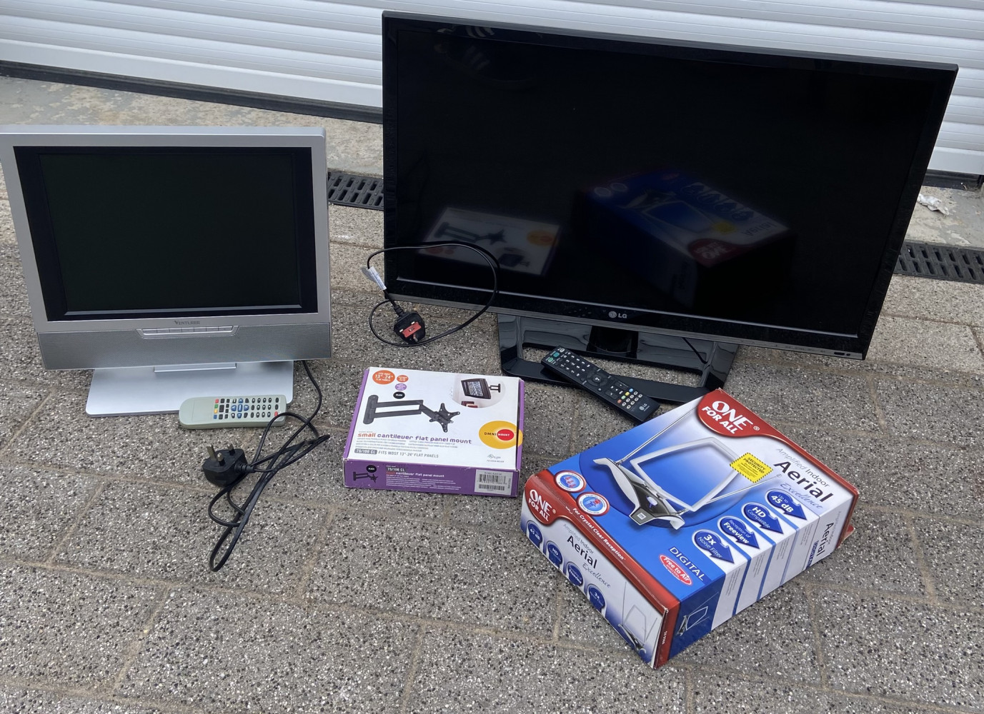 Large LG TV, wall bracket aerial and Smaller TV all with remotes