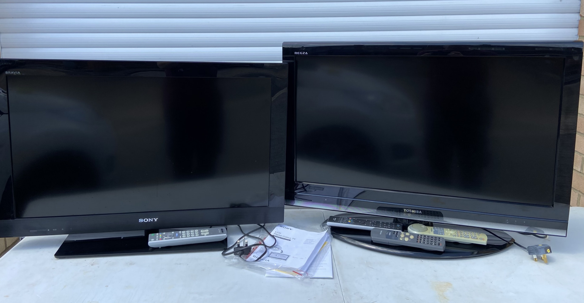 2 large televisions with remotes 