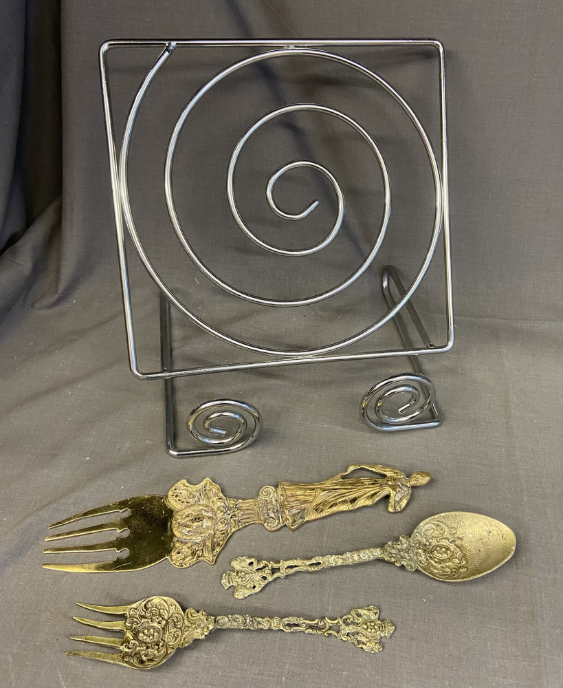 Book stand and 3 large brass cutlery items