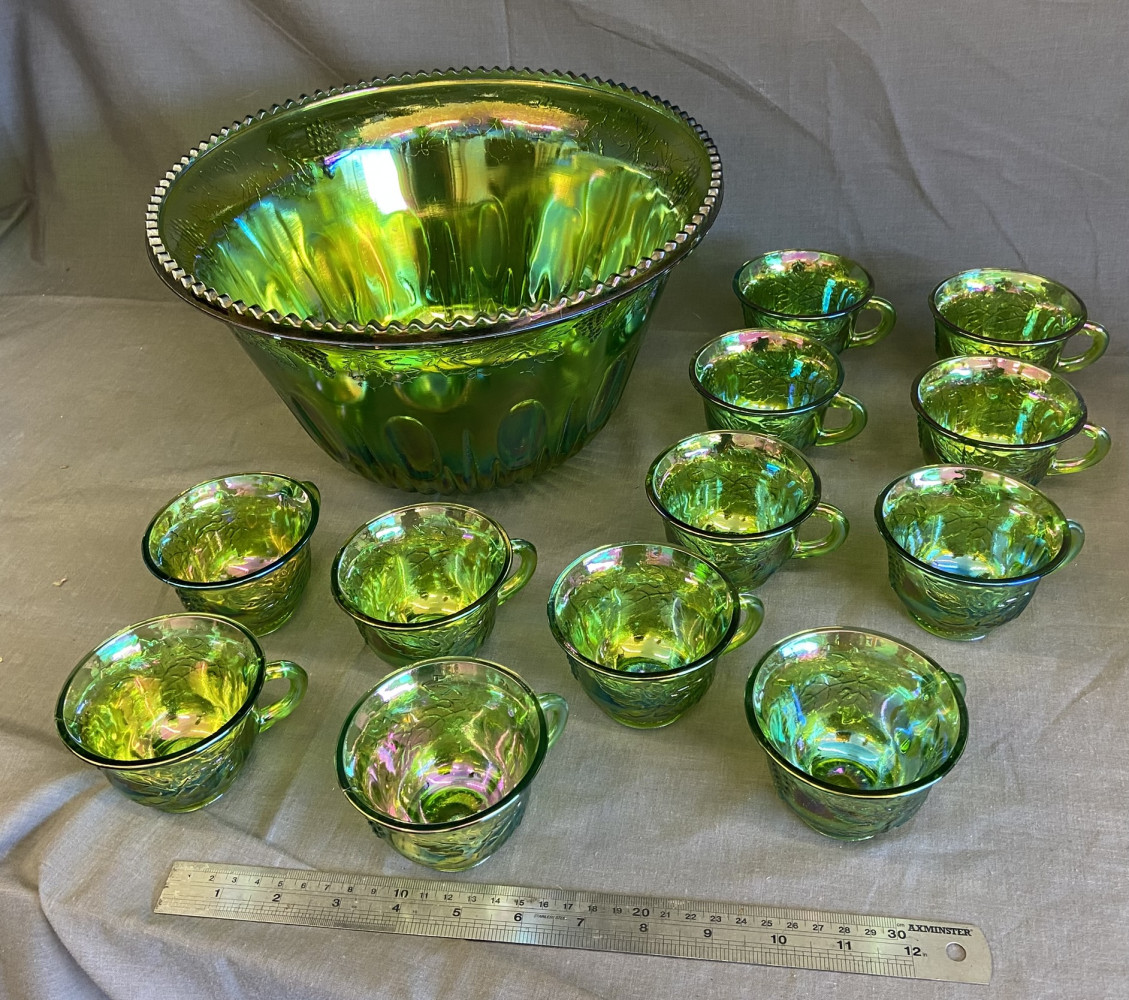 Large green carnival glass punch bowl with 12 cups (2 have small chips)