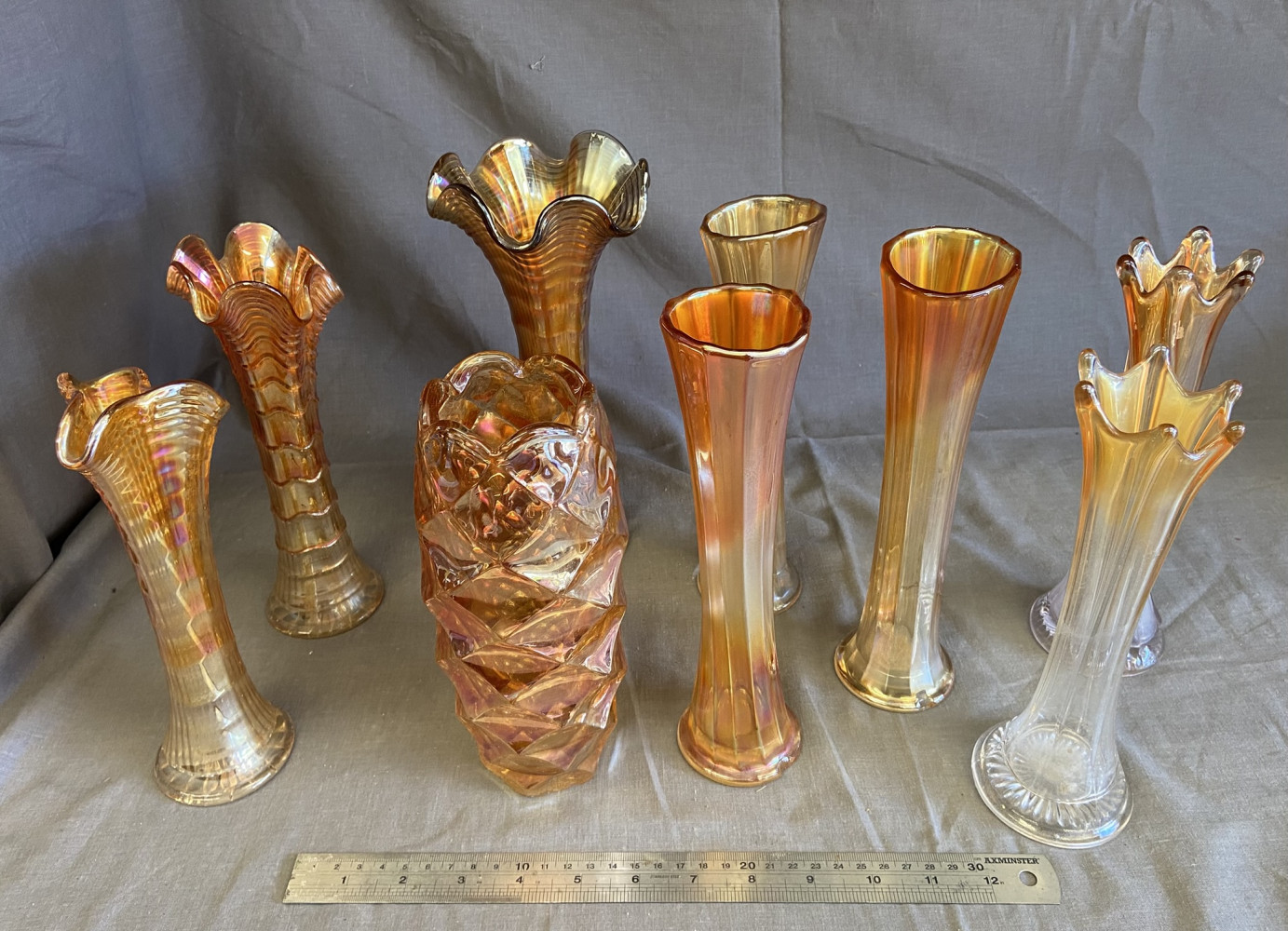 9 small carnival glass vases