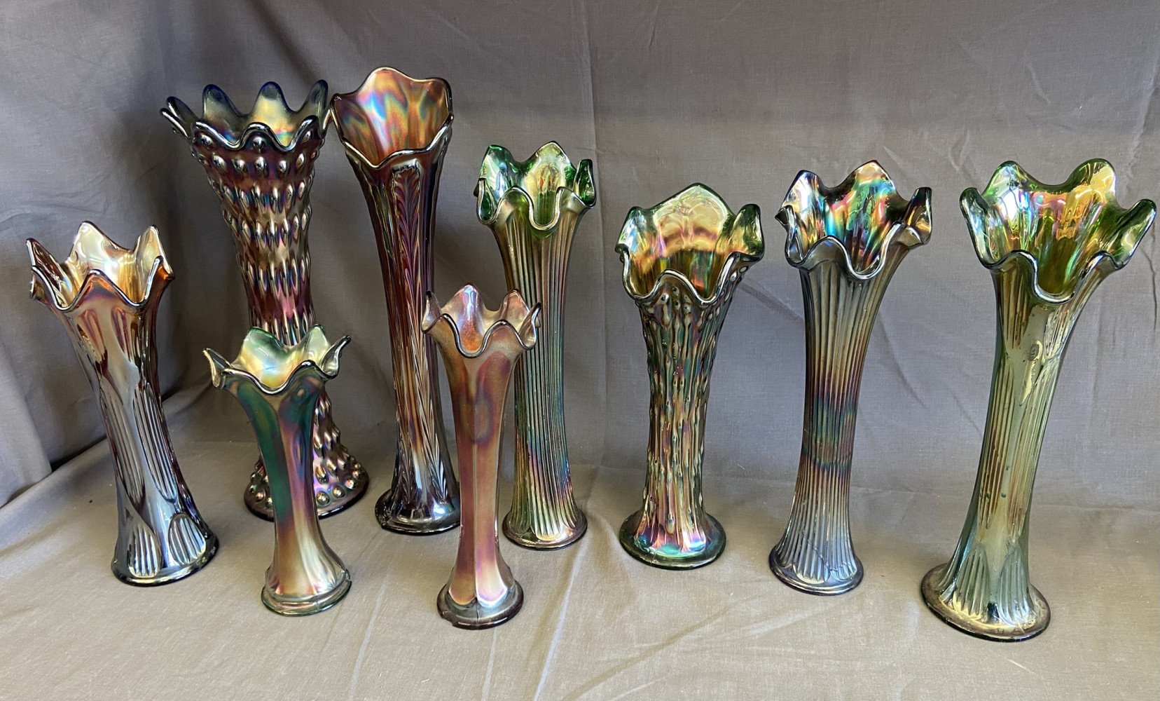 Large selection of Multi coloured Carnival Glass vases