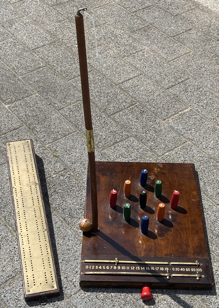 Vintage pub games, brass cribbage board and skittles