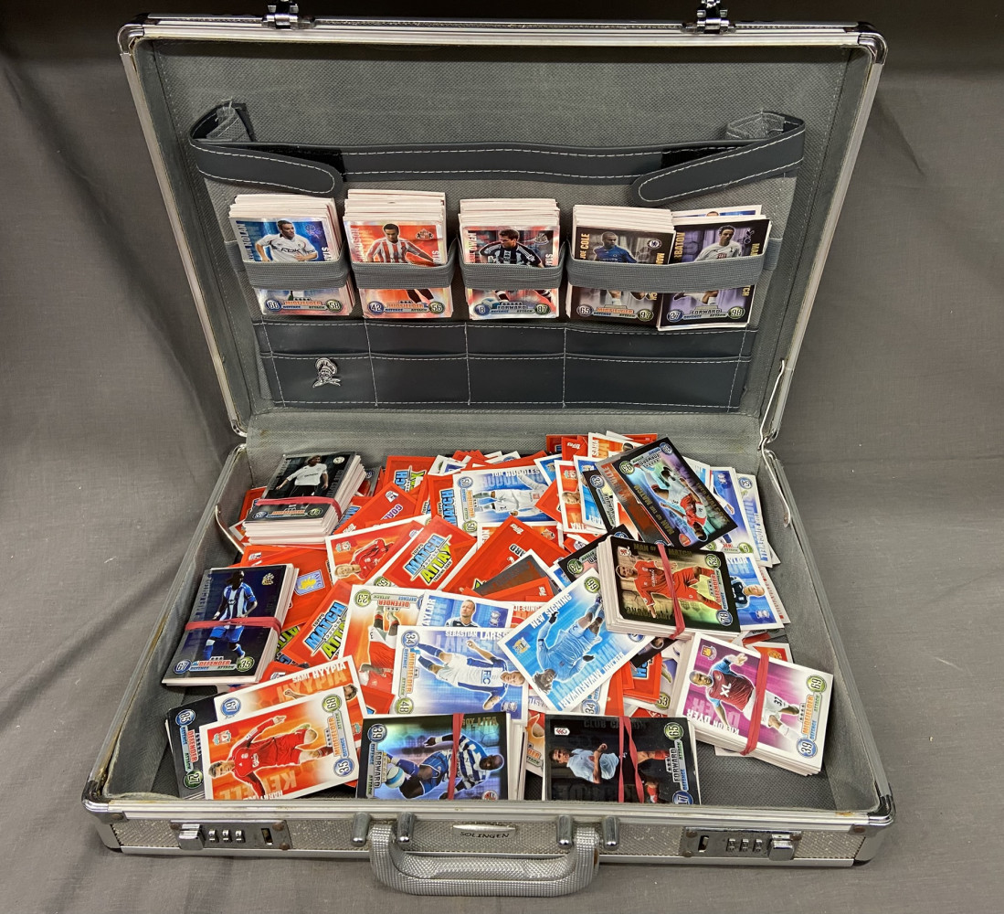 Case full of football trading cards 