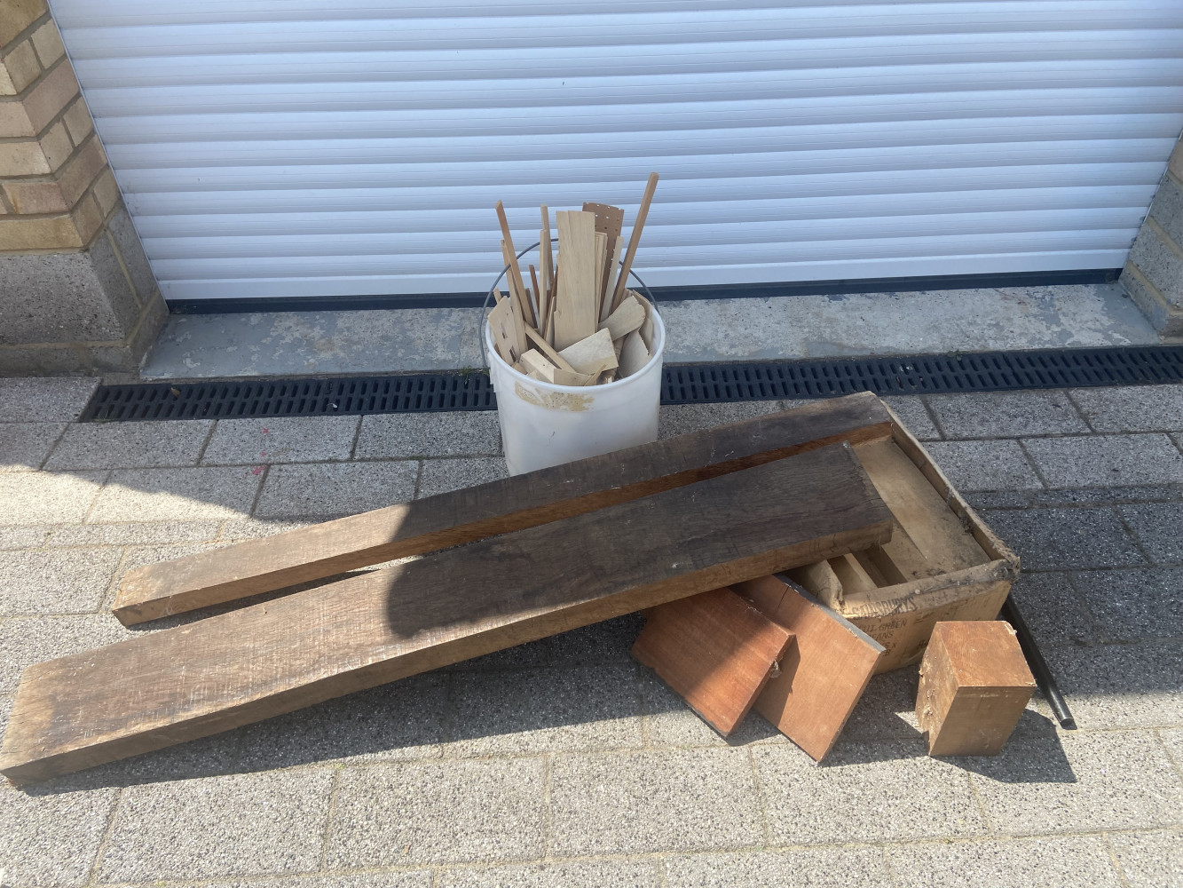 Oak plank, tub of balsa wood and box of turning blanks