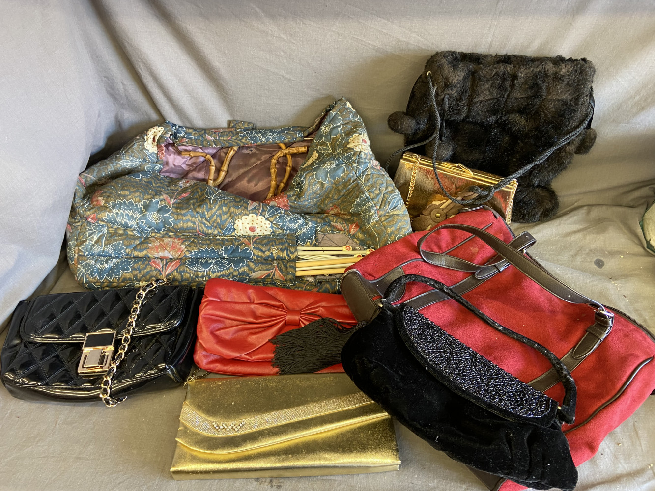 Sewing bag with needles and collection of handbags