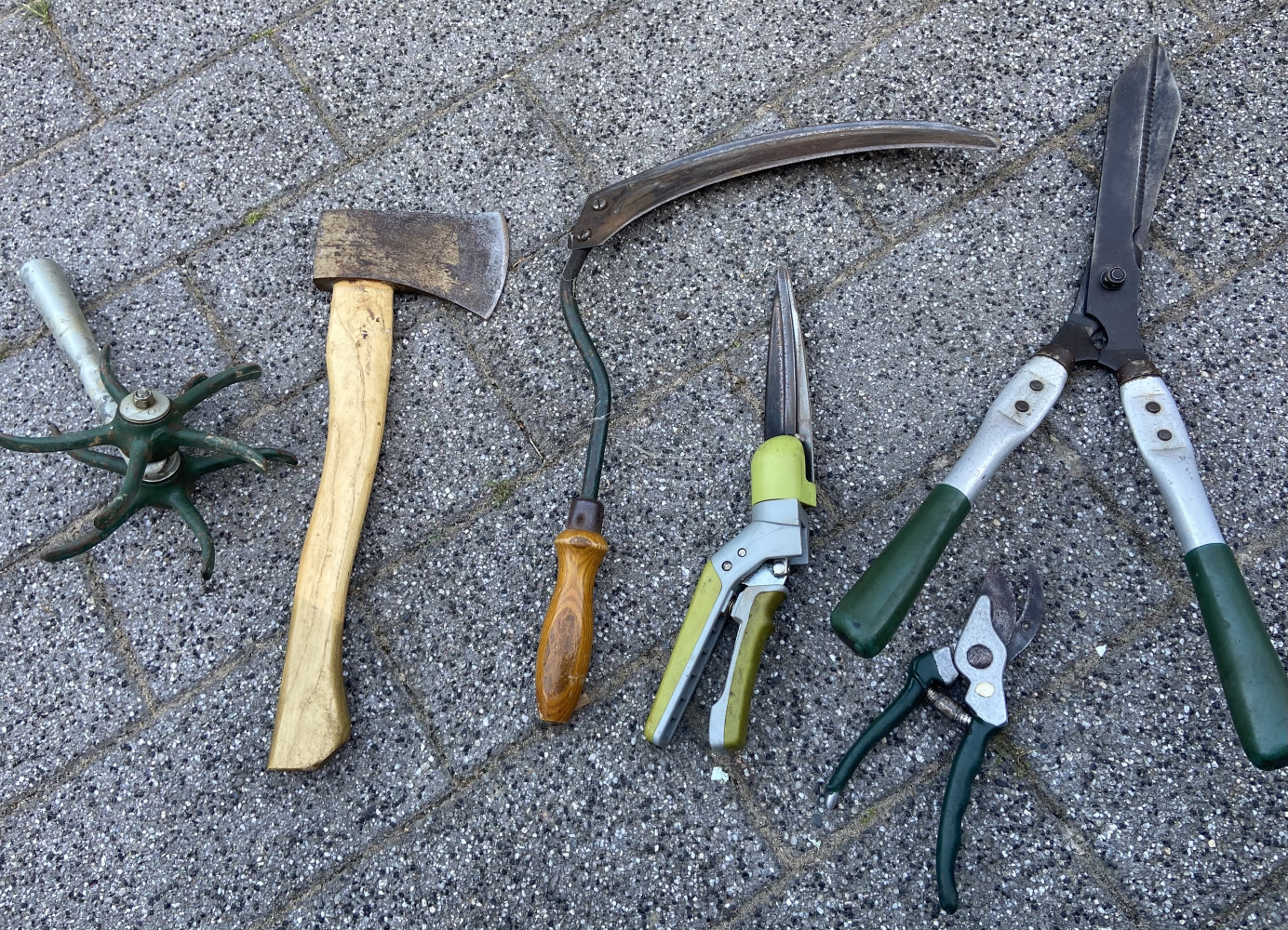 Axe, scythe and other garden tools