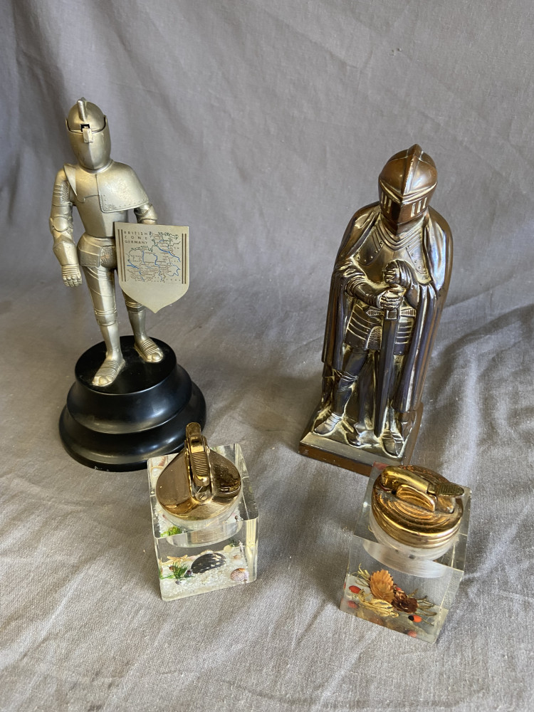 Table lighters in form of knights and two resin lighters