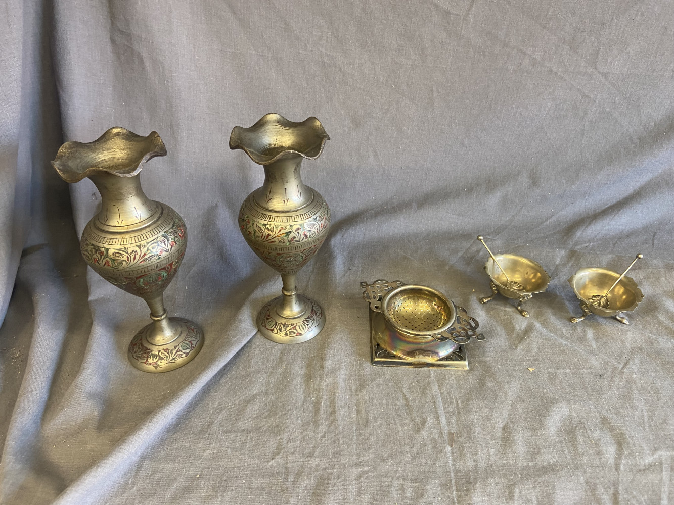 Silver plated salts and tea strainer and 2 metal vases