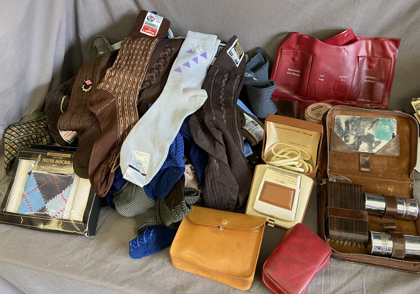 Large mixed lot of new socks, vintage shaver and shoe shine kits