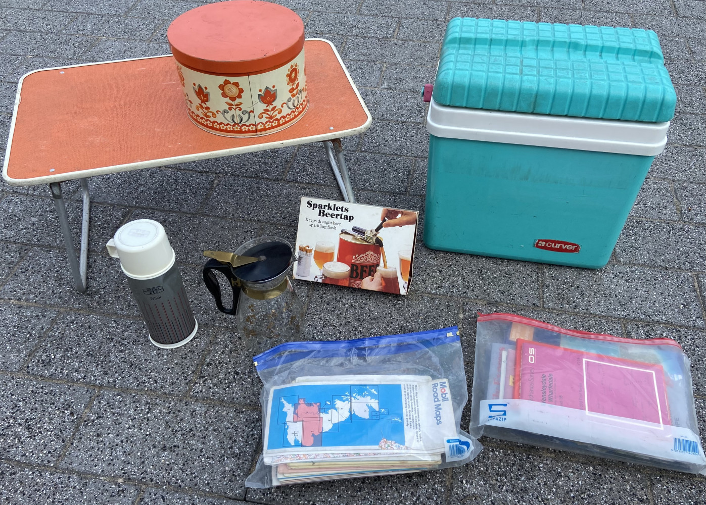 Vintage travel items, maps and a sparklets beertap